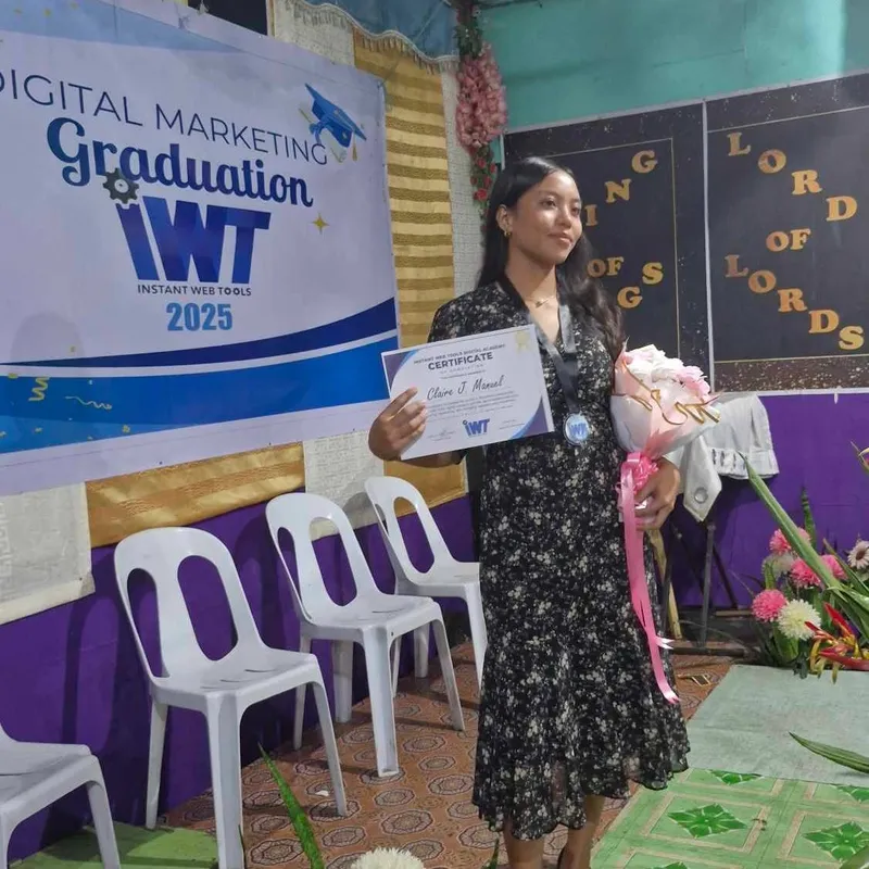 A graduate holding her digital marketing certificate